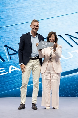Director of Monfalcone Shipyard Cristiano Bazzra with Carnival Cruise Line President Chritine Duffy hold first piece of steel to celebrate start of construction