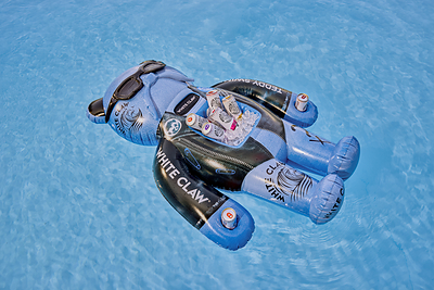 The Floatmate: White Claw® x Teddy Swims Limited-Edition Floatie is a go-to summer accessory with a built-in cooler, can holders and waterproof Bluetooth speaker to keep the Claws® cold and vibes going.