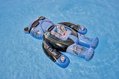 The Floatmate: White Claw® x Teddy Swims Limited-Edition Floatie is a go-to summer accessory with a built-in cooler, can holders and waterproof Bluetooth speaker to keep the Claws® cold and vibes going.