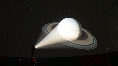 Visual of Saturn on the screen at the McDonnell Planetarium (part of the Saint Louis Science Center).