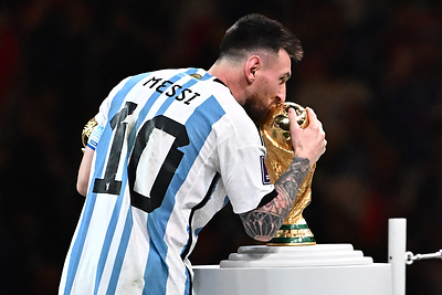 Messi kissing the World Cup trophy in 2022 - can he do it again in 2026?