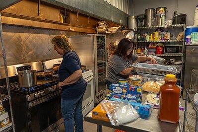 TriStar Bank employees prepare meals for individuals served by Kinsmen Redeemer Ministry during a Day of Service Friday, June 19, 2026. 