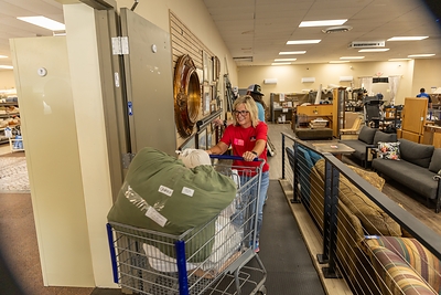TriStar Bank employees sort bedding at the Habitat for Humanity Restore during a Day of Service Friday, June 19, 2026. 