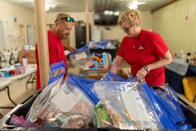 TriStar Bank employees prepare snack packs for individuals served by Kinsmen Redeemer Ministry during a Day of Service Friday, June 19, 2026. 