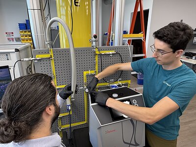 Mechanical Engineer Sam Heyd and Chemical Engineer Brenden Pelkie install a helium leak detector at Interlune’s Cryogenic Lab at the company’s Seattle headquarters Mechanical Engineer Sam Heyd and Chemical Engineer Brenden Pelkie install a helium leak detector at Interlune’s Cryogenic Lab at the company’s Seattle headquarters