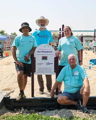 Pictured (right to left): Michael Aziz, Chief Distribution Officer, Foresters Financial; David Talbot, Assistant Vice President, Foresters Financial; Andrea Frossard, Chief Commercial Officer, Foresters Financial; and Richard Hennick, International Fraternal President, Foresters Financial, celebrate the completion of the new playground at Future Charter Academy in Calgary, Alberta.