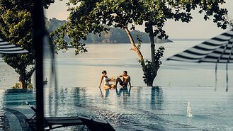 Couple in pool at Pullman Phuket, Thailand
