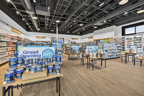 The store offers an extensive assortment of vitamins, sports nutrition products, functional foods, healthy on-the-go snacks, energy drinks, and everyday wellness essentials.