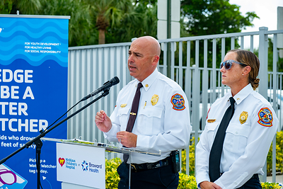 Stephen Gollan, Fort Lauderdale Fire Rescue Chief (left), along with Alex Bagwell, Fort Lauderdale Ocean Rescue Chief (right), address the media during a press conference about water safety at the L.A. Lee YMCA/Mizell Community Center on Wednesday, July 22, 2026, in Fort Lauderdale, Florida.