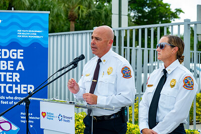 Stephen Gollan, Fort Lauderdale Fire Rescue Chief (left), along with Alex Bagwell, Fort Lauderdale Ocean Rescue Chief (right), address the media during a press conference about water safety at the L.A. Lee YMCA/Mizell Community Center on Wednesday, July 22, 2026, in Fort Lauderdale, Florida.