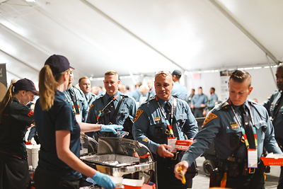 Rapid Relief Team volunteers conduct meal service with members of New Jersey Police 
