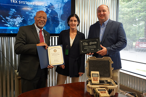 Congressman Glenn Ivey (left) with Carol Politi, President of TRX Systems (center),  and Garret Maxson, Vice President of Operations at ACDi (right)