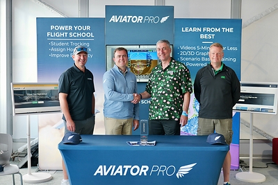 University of North Dakota and AviatorPro solidify a partnership with AviatorPro. Pictured are Chad Martin, Luke Ormsby, Dean Robert Kraus, and Jeremy Roesler.