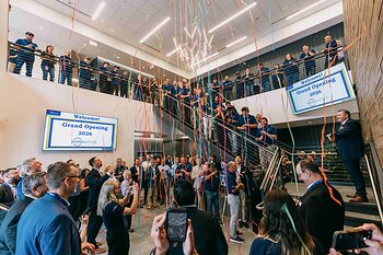 Employees celebrate grand opening