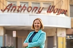 Jennifer L. Carlson, Executive Director of Anthony Wayne Theater, stands in front of the historic theater in Wayne, Pennsylvania.