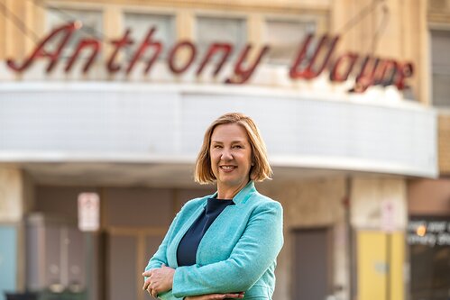 Jennifer L. Carlson, Executive Director of Anthony Wayne Theater, stands in front of the historic theater in Wayne, Pennsylvania.