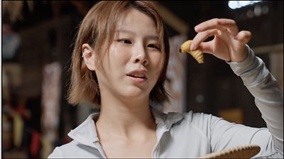 Estelle Fly take on the Sago Worm Challenge, sampling one of Sarawak's most iconic delicacies.