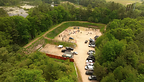 Aerial view of the active, outdoor tactical firearms training range at Lykos Training Center in Southeastern Massachusetts, showcasing ample facility space and designated training bays.