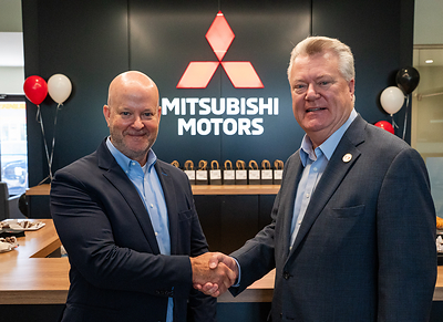 Allen Borden, deputy commissioner, Tennessee Dept of Economic and Community Development (right) congratulates Mark Chaffin, president & CEO, Mitsubishi Motors North America, on the grand opening of Mitsubishi Motors’ first Gallery dealership in the United States, located in Antioch, Tenn.