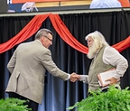 Memoria College's Martin Cothran (left) presents the 2026 Parnassus Prize to Malcolm Guite during the Memoria National Conference in Louisville, Kentucky, earlier this month.