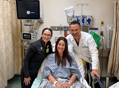 Dr. Melanie L. Aya-Ay, plastic surgeon, and Dr. Robert Gabordi, breast surgical oncologist and medical director of BayCare’s St. Joseph’s Hospitals breast surgery program, with Kimberley Kirtley on July 29, 2026. Kimberly is the first patient to undergo BayCare's new robotic-assisted nipple-sparing mastectomy procedure.