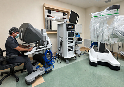 Dr. Robert Gabordi, breast surgical oncologist and medical director of BayCare’s St. Joseph’s Hospitals breast surgery program, demonstrates the new robotic surgical platform that was used to perform the health system's first robotic-assisted nipple-sparing mastectomy procedure.