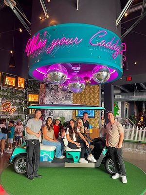 Ultimate Staffing coworkers in Irvine, CA recharging together at a local miniature golf spot.