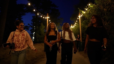 Fairy lit trees and illuminated pathways lead guests from the Memories of Summer festival grounds to the shoreline.