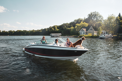 Friends and four-legged companions enjoy a sunny day on the water. Discover more ways to make boating part of your summer at DiscoverBoating.com. (Photo courtesy of Discover Boating)