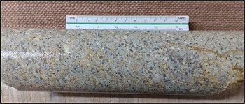 Figure 4 - Outcropping felsic ignimbrite (above) with flattened porphyritic lapilli fragments; porphyritic felsic lapilli tuff (below) in EZD0008 (88.0m depth)