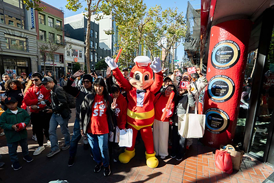 The Jollibee mascot poses with excited customers outside the new downtown San Francisco restaurant at 934 Market St. on Friday, July 31, 2026. Jollibee was recently named America’s “best fast-food fried chicken” by USA Today for the third consecutive year. (Photo: Jollibee)