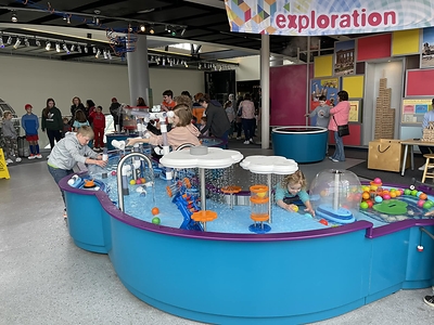 Children explore the interactive water tables in Discovery Park of America's Energy Gallery. The hands-on exhibit will remain part of Megawatts: The Exhibit following the gallery's renovation.