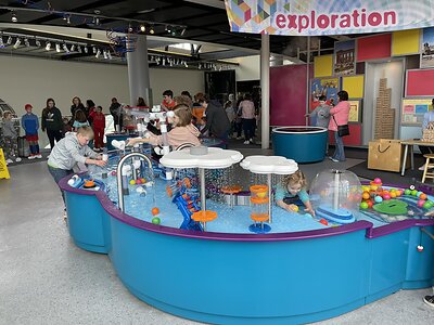 Children explore the interactive water tables in Discovery Park of America's Energy Gallery. The hands-on exhibit will remain part of Megawatts: The Exhibit following the gallery's renovation.