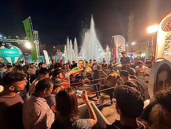 Football fans gather around football challenges at an Infinix World Cup community event in Iraq.