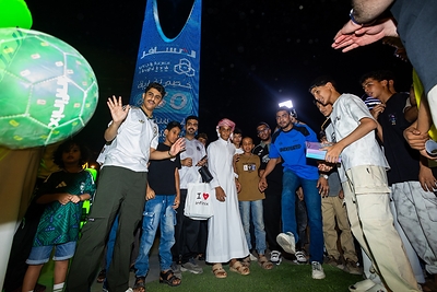 Football fans participate in football challenges at an Infinix World Cup watch party in Saudi Arabia.