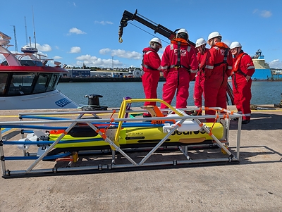 FMS operators preparing for on-water training with Bedrock's autonomous underwater vehicle. 