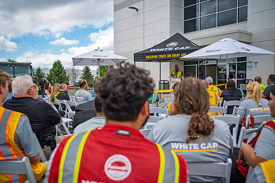 Community partners and employees enjoy the ceremony