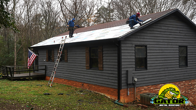 Gator Metal Roofing professionals installing the Sweepstakes winner's new metal roof.
