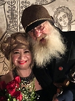 The award-winning film composer and concert pianist Maria Andriasova with her colleague, legendary filmmaker Godfrey Reggio in front of Guillermo Esparza's Mural of Ezekiel 37. All Rights Reserved.
