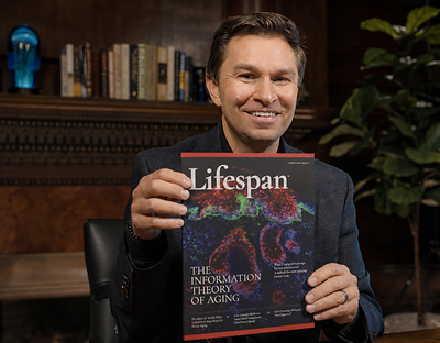 Dr. David Sinclair, A.O., Ph.D., with the inaugural issue of Lifespan Magazine