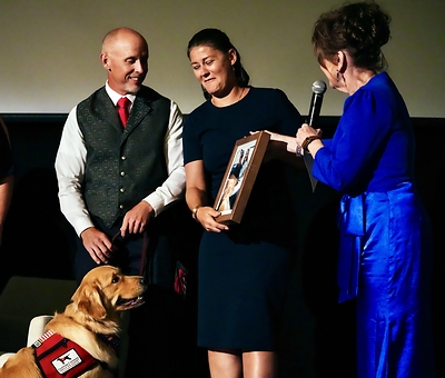 L-R:  Army veteran Mike Mohr and Jody Hager of the Army National Guard learn from AWI CEO Louise Thaxton that the Service Dog named Dream they have trained will stay with them.