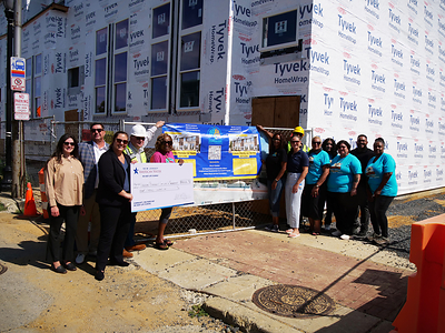 Left to right: Olivia Filaferro, Donovan Architects; Mike Donovan, Donovan Architects; Chelsea Kulp, New Jersey American Water; Walter Lynch, Gardner Construction; Miosha Lawrence, PBCIP; John Bond, PBCIP; Erin Banes, New Jersey American Water; Sarah Drummond; Nadine Mendendez Benson, PBCIP; Shirley Irizarry, PBCIP; Joey Rodriguez, American Water; and Indya Walker, PBCIP, pictured at the Hardy Homes Townhome Development at 1454-1460 Haddon Avenue, Camden, NJ. 