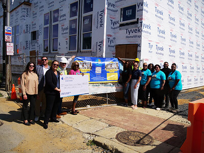 Left to right: Olivia Filaferro, Donovan Architects; Mike Donovan, Donovan Architects; Chelsea Kulp, New Jersey American Water; Walter Lynch, Gardner Construction; Miosha Lawrence, PBCIP; John Bond, PBCIP; Erin Banes, New Jersey American Water; Sarah Drummond; Nadine Mendendez Benson, PBCIP; Shirley Irizarry, PBCIP; Joey Rodriguez, American Water; and Indya Walker, PBCIP, pictured at the Hardy Homes Townhome Development at 1454-1460 Haddon Avenue, Camden, NJ. 