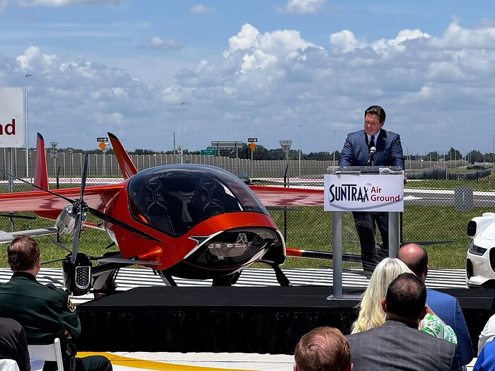 Florida Gov. Ron DeSantis speaks beside AIR ONE at SunTrax in Auburndale, Florida.