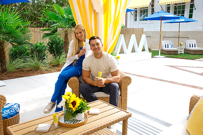 Tyler Cameron and Dr. Chloe Goldman in the renovated, sun-safe backyard with NEW CeraVe Invisible Mineral Sunscreen SPF 50.
