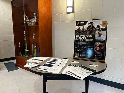 a table with informational materials about the event