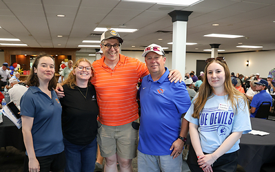 Orange EV employees join Kansas City Kansas Community College representatives at the Blue Devil Golf Classic.
