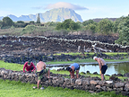 Practitioners of Hui Mālama O Kāneiolouma set the final stones of the restored inner wall at the Kāneiolouma Heiau Complex, Poʻipū, Kauaʻi. Photo: Kaneioluma.org.