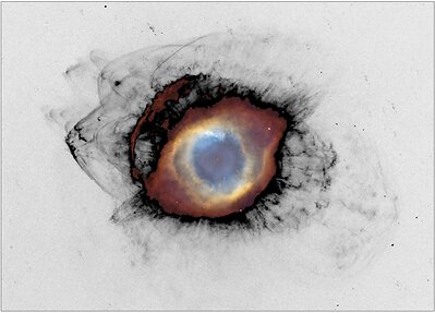 The Helix Nebula and the cosmic recycling of stellar material. The bright central nebula surrounds a white dwarf, the remnant of the star that created it. Farther out, newly revealed bow shocks show fragments of material cast off by that star colliding with surrounding interstellar gas. The fragments become progressively smaller and more disrupted as they are stripped, shredded and mixed into space. The new MOTHRA data is shown in black, with previous data from the Hubble Space Telescope and the Kitt Peak 4m telescope in color. Credit for the previous data: NASA, ESA, C. R. O’Dell (Vanderbilt University) and M. Meixner, P. McCullough and G. Bacon (Space Telescope Science Institute). The Helix Nebula and the cosmic recycling of stellar material. The bright central nebula surrounds a white dwarf, the remnant of the star that created it. Farther out, newly revealed bow shocks show fragments of material cast off by that star colliding with surrounding interstellar gas. The fragments become progressively smaller and more disrupted as they are stripped, shredded and mixed into space. The new MOTHRA data is shown in black, with previous data from the Hubble Space Telescope and the Kitt Peak 4m telescope in color. Credit for the previous data: NASA, ESA, C. R. O’Dell (Vanderbilt University) and M. Meixner, P. McCullough and G. Bacon (Space Telescope Science Institute).