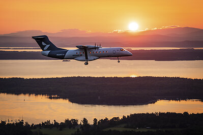 Heart Aerospace’s X1 demonstrator aircraft flies toward the rising sun above upstate New York’s Champlain Valley during its first flight. (Photo: Heart Aerospace)